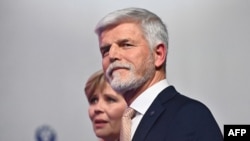 FILE - Presidential candidate Petr Pavel and his wife Eva arrive for a news conference in Prague, Czech Republic on Jan. 28, 2023, after Pavel became the fourth president of the Czech Republic.