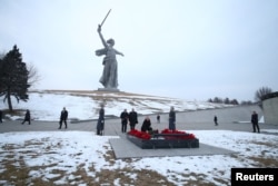 Russian President Vladimir Putin lays flowers on the tomb of Soviet Marshal Vasily Chuikov at the Mamayev Kurgan memorial complex in Volgograd, Russia, Feb. 2, 2023. (Sputnik/Kirill Braga/Pool via Reuters)