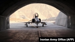 A handout picture provided by the Iranian Army Office on Feb. 7, 2023, shows a fighter jet during the unveiling of Iran's first underground military air base in an undisclosed location.
