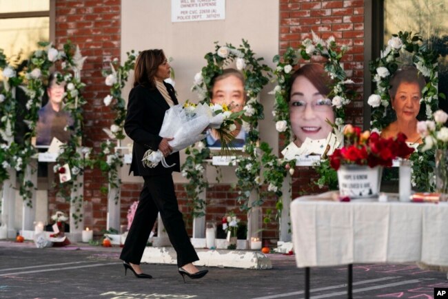 FILE - Vice President Kamala Harris visits a memorial set up outside Star Dance Studio in Monterey Park, California, Jan. 25, 2023.