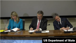 Secretary of State Antony J. Blinken, Mexican Foreign Secretary Marcelo Ebrard, and Canadian Foreign Minister Melanie Joly sign the North American Declaration on Partnership for Equity and Racial Justice.