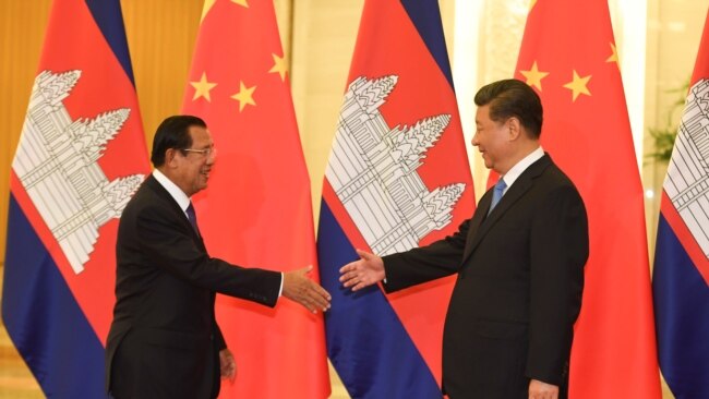 FILE - Cambodia’s Prime Minister Hun Sen shakes hands with China's President Xi Jinping before their meeting at the Great Hall of the People in Beijing, Apr. 29, 2019. (Madoka Ikegami/Pool via Reuters)