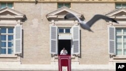 Pope Francis delivers his speech during the Angelus noon prayer from the window of his studio overlooking St. Peter's Square, at the Vatican, Feb. 12, 2023.