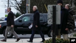President Joe Biden walks from St. Edmund Roman Catholic Church after attending Mass in Rehoboth Beach, Del., Saturday, Jan. 21, 2023.