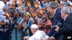 Pope Francis greets worshippers at Notre Dame du Congo cathedral in Kinshasa, Congo, Feb. 2 2023. 