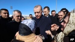 FILE - On Feb. 8, 2023, Turkey's President Recep Tayyip Erdogan visits Kahramanmaras, Turkey, which was damaged by a 7.8 magnitude earthquake two days earlier. He later described criticism of Ankara’s response to the earthquake as “false news."