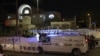 Israeli emergency service personnel close off the site of an attack at a synagogue in a settler neighborhood of Israeli-annexed East Jerusalem, on Jan. 27, 2023.