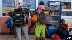 FILE - Migrants gather at a bus station after crossing the border between Mexico and Guatemala, in Tapachula, Mexico, Jan. 19, 2023.