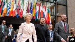 From left, European Commission President Ursula von der Leyen, Ukraine's President Volodymyr Zelenskyy and European Council President Charles Michel walk together to a media conference at an EU summit in Brussels, Feb. 9, 2023.