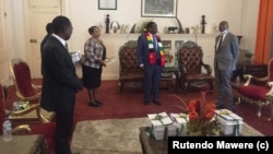 FILE: Justice Priscilla Chigumba of ZEC handing over the Revise Preliminary Delimitation Report to President Emmerson Mnangagwa