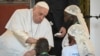 FILE: Pope Francis (L) blesses a child as he meets with victims of the conflict in eastern Democratic Republic of Congo (DRC) at the Apostolic Nunciature in Kinshasa, DRC, on February 1, 2023.