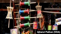 Kite flying materials on display at a shop in India. Because of police raids, kite shops do not keep the banned Chinese Manjha kite strings on display.