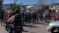 Armed police protest in Port-au-Prince, Haiti, Jan. 26, 2023, after a gang attack on a police station in Liancourt the day before left several officers dead.