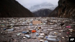 Waste floats in the Drina River near Visegrad, Bosnia, Jan. 20, 2023.