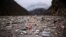 Waste floats in the Drina River near Visegrad, Bosnia, Jan. 20, 2023.