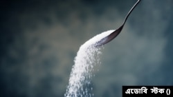 FILE: Representative illustration of a spoonful of sugar, a metaphor for older men who shower young women with favors in return for their company and more. Taken Feb. 18, 2006.