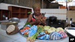 Rose Felicien prepares ingredients to make soup joumou, at a restaurant in the Delmas district of Port-au-Prince, Haiti, Feb. 5, 2023.