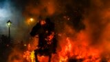 A man rides a horse through a bonfire as part of a ritual in honor of Saint Anthony the Abbot, the patron saint of domestic animals, in San Bartolome de Pinares, Spain, Jan. 16, 2023.