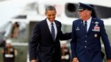 FILE - Michael Minihan, right, now a U.S. Air Force general, walks with President Barack Obama to board Air Force One, at Andrews Air Force Base, Maryland, June 4, 2012.