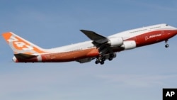 FILE - A Boeing 747-8 takes its first flight, March 20, 2011, at Paine Field in Everett, Wash. After more than half a century, Boeing is rolling its last 747 out of a Washington state factory on Tuesday night. 