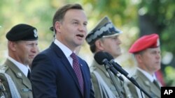 Polish President Andrzej Duda speaks during Polish Army Day celebrations in Warsaw, Poland, Aug. 15, 2015.