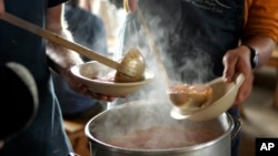 FILE - Tomato vegetable soup is served at Madison Spring Hut in the White Mountains of New Hampshire, Monday, June 11, 2007. (AP Photo/Robert F. Bukaty, File)