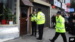 Police outside a property in Birmingham, England, March 23, 2017, following an attack on Wednesday in London.