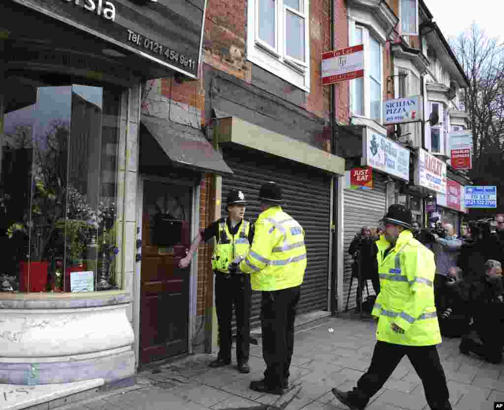 Police outside a property in Birmingham, England, March 23, 2017, following an attack on Wednesday in London.