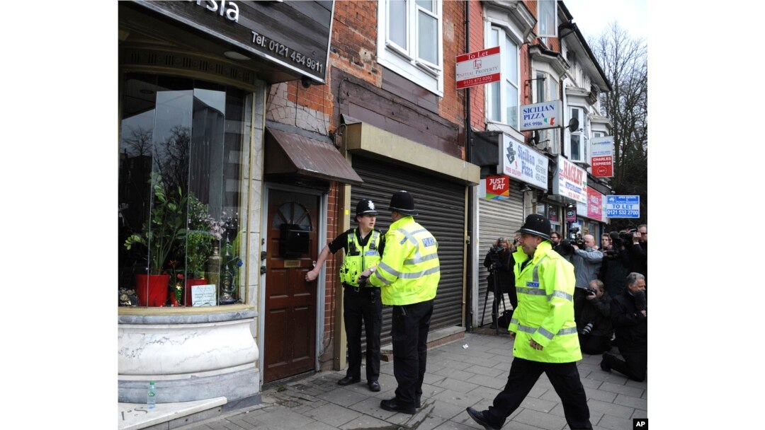 Police outside a property in Birmingham, England, March 23, 2017, following an attack on Wednesday in London.