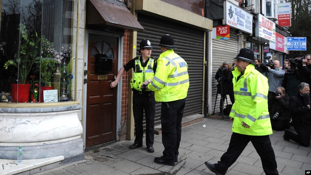 Police outside a property in Birmingham, England, March 23, 2017, following an attack on Wednesday in London.
