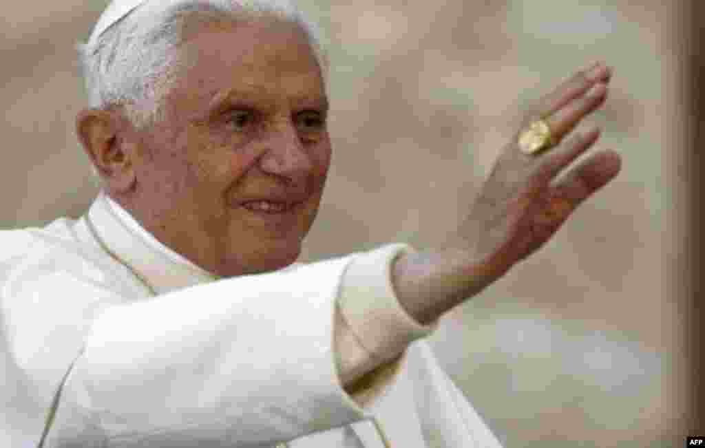 Pope Benedict XVI waves as he is driven through the crowd in St. Peter's Square during his weekly general audience, at the Vatican, Wednesday, Sept. 29, 2010. Benedict XVI is praying for the victims of floods in northern Nigeria that have left 2 million p