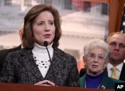 FILE - Rep. Vicky Hartzler, R-Mo., left, speaks to reporters on Capitol Hill in Washington, March 25, 2014.