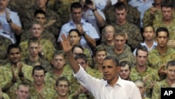 U.S. President Barack Obama waves to the troops after speaking at the Royal Army Air Force Base in Darwin, Australia, November 17, 2011.