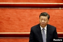 资料照“中国领导人习近平在北京人大会堂举行的全国政协十三届五次会议开幕式上。（2022年3月4日）