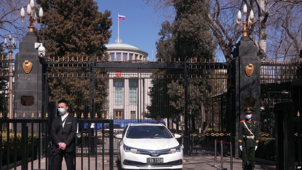 A Chinese paramilitary policeman stands guard a the entrance to the Russian Embassy in Beijing on Tuesday, March 1, 2022. (AP Photo/Ng Han Guan)