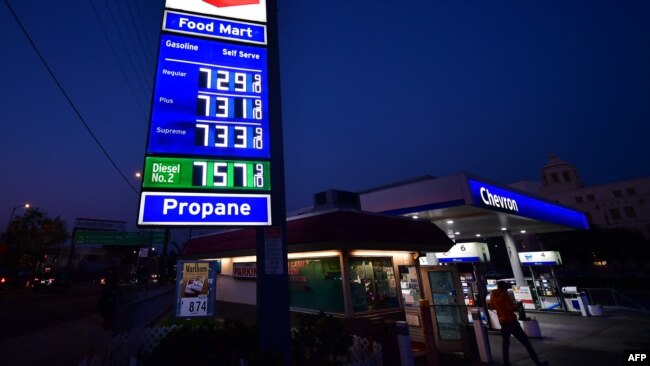 Gas prices are posted at a Los Angeles gas station on March 9, 2022. U.S. President Joe Biden is due to speak Wednesday about gas prices and the economic effects of Russia’s war in Ukraine as he considers whether to support suspending the nation’s federal gas tax.