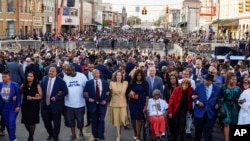 Vice President Kamala Harris marches on the Edmund Pettus Bridge after speaking in Selma, Ala., on the anniversary of "Bloody Sunday," a landmark event of the civil rights movement, March 6, 2022.