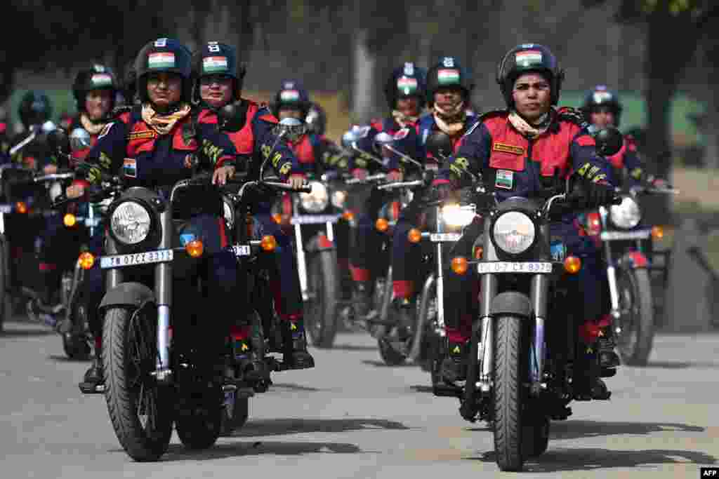 Indian Border Security Force personnel from the women&#39;s motorcycle team &#39;Sema Bhawani&#39; ride their Royal Enfield motorcycles during the BSF Seema Bhawani Shaurya expedition-Empowerment Ride at India Gate in New Delhi, to mark International Women&#39;s Day.