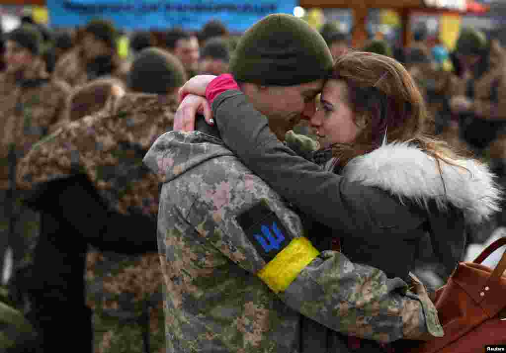 Olga hugs her boyfriend Vlodomyr as they say goodbye prior to Vlodomyr&rsquo;s deployment closer to the front line, amid Russia&#39;s invasion of Ukraine, at the train station in Lviv, Ukraine.