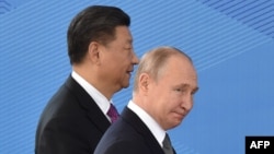 2019年6月14日中国国家主席习近平和俄罗斯总统普京出席在吉尔吉斯斯坦首都比什凯克举行的上海合作组织成员国元首理事会