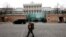 FILE - A member of the Austrian armed forces walks past Palais Coburg, site of talks on the Iran nuclear deal, in Vienna, Austria, Feb. 8, 2022.