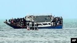 This photo provided by the United States Border Patrol shows a boat that ran aground in the Florida Keys off Key Largo on March 6, 2022.