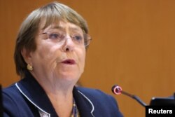 FILE - United Nations High Commissioner for Human Rights Michelle Bachelet attends the special session of the UN Human Rights Council at the United Nations, in Geneva, March 3, 2022.