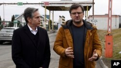 U.S. Secretary of State Antony Blinken, left, and Ukrainian Foreign Minister Dmytro Kuleba speak to the media at the Ukrainian-Polish border crossing in Korczowa, Poland, March 5, 2022.