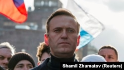 FILE - Alexei Navalny takes part in a rally to mark the 5th anniversary of opposition politician Boris Nemtsov's murder and to protest against proposed amendments to the country's constitution, in Moscow, Russia February 29, 2020. (REUTERS/Shamil Zhumatov/File)