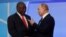 FILE - Russian President Vladimir Putin and South African President Cyril Ramaphosa speak during a Russia-Africa Summit in the Black Sea resort of Sochi, Russia, Oct. 23, 2019.