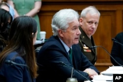 FILE - Central Intelligence Agency Director William Burns, center, testifies on Capitol Hill in Washington, March 8, 2022.