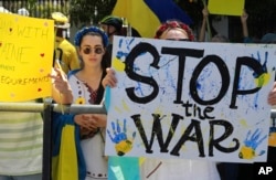 Ukrainians protest against Russia's invasion of Ukraine in front of Parliament in Cape Town, South Africa, March 1, 2022.