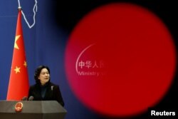 FILE - Chinese Foreign Ministry spokesperson Hua Chunying attends a news conference in Beijing, China, Feb. 24, 2022.