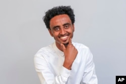 FILE - Freelance video journalist Amir Aman Kiyaro, who is accredited to The Associated Press, is pictured in Ethiopia, Oct. 17, 2021.